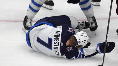 Jets forward Namestnikov is taken to the hospital after a puck hit him in the face