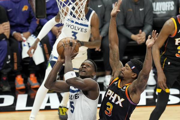 Timberwolves outlast Suns to finish sweep. Minnesota coach Chris Finch leaves with knee injury