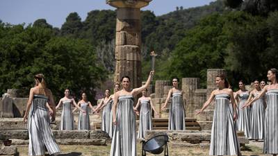 Despite weather glitch, the Paris Olympics flame is lit at the Greek cradle of ancient games